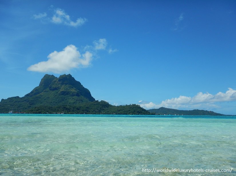 Paul Gauguin Cruises Tahiti & Society Islands Luxury Travel Virtuoso Izumi Ogawa Trip agent vacation advisor Vision French Polynesia Cruise ship boat Bora Bora ocean water sand beach